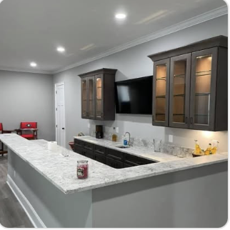 After: completed basement renovation with finished walls, flooring, and trim by Keystone South Construction