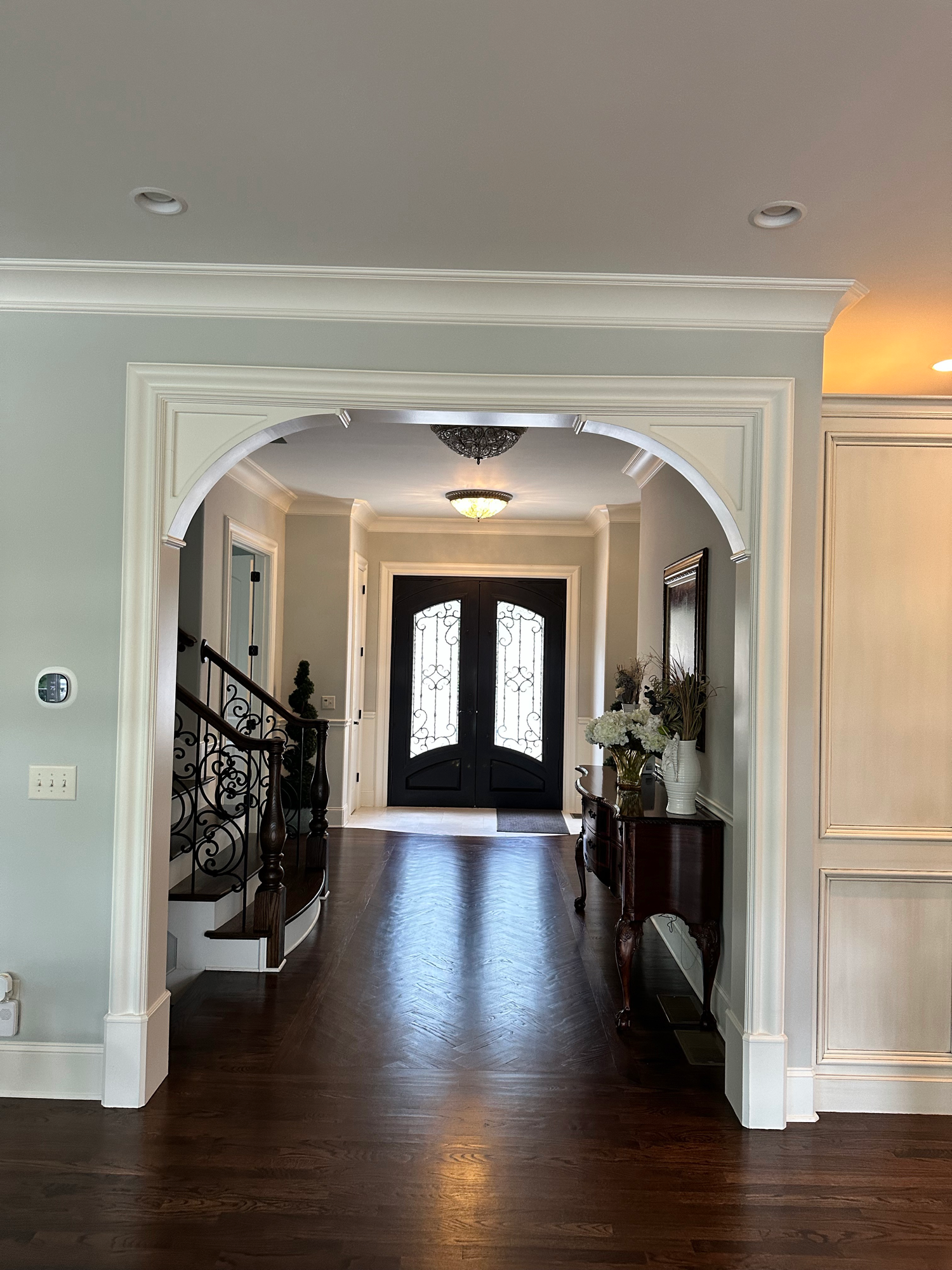 Interior archway and foyer hallway with crown molding — Lake Lanier home by Keystone South Construction